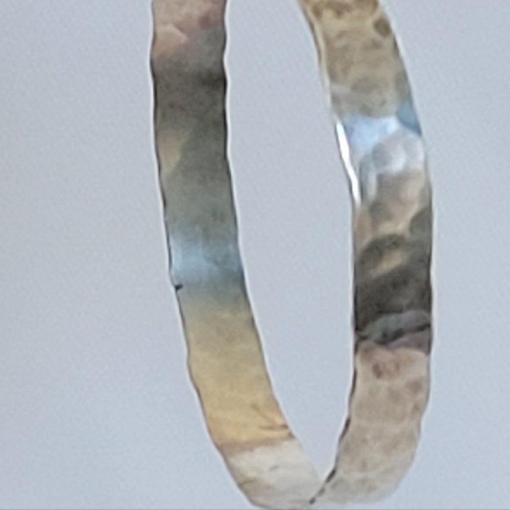Vintage hammered silver earrings handmade for me in 1978. Hoops hanging on wire.